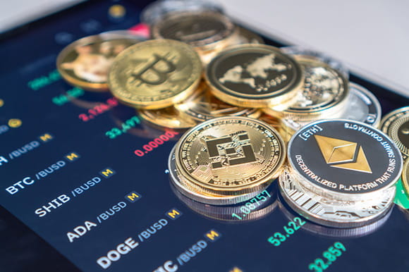 bitcoin tokens laid out on a phone screen