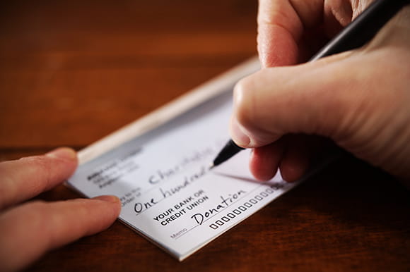 Someone writing a check