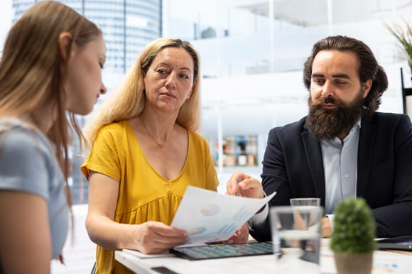 mom and teen daughter and dad talk about good money habits