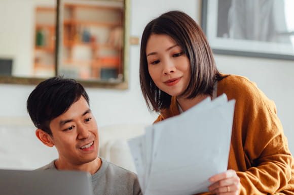 A couple looking over paperwork