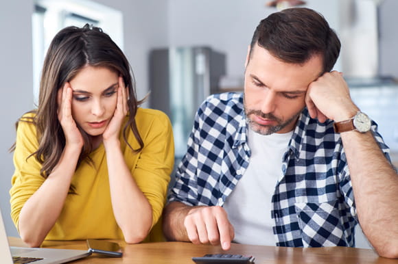 man and woman figuring out their budgeting,  money impacts relationship
