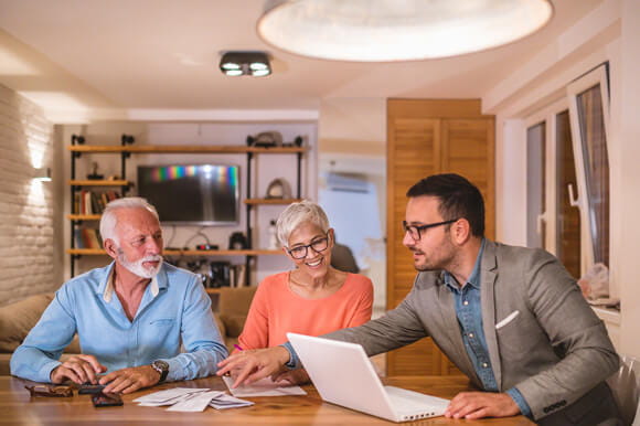An older couple meeting with an advisor