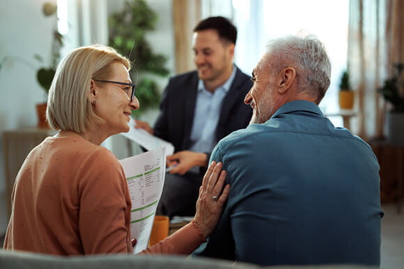 An older couple meeting with an advisor